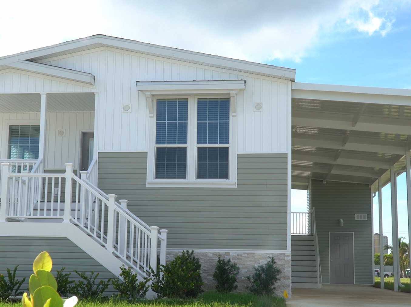 Exterior view of a modern manufactured home showcasing high-quality construction and custom design