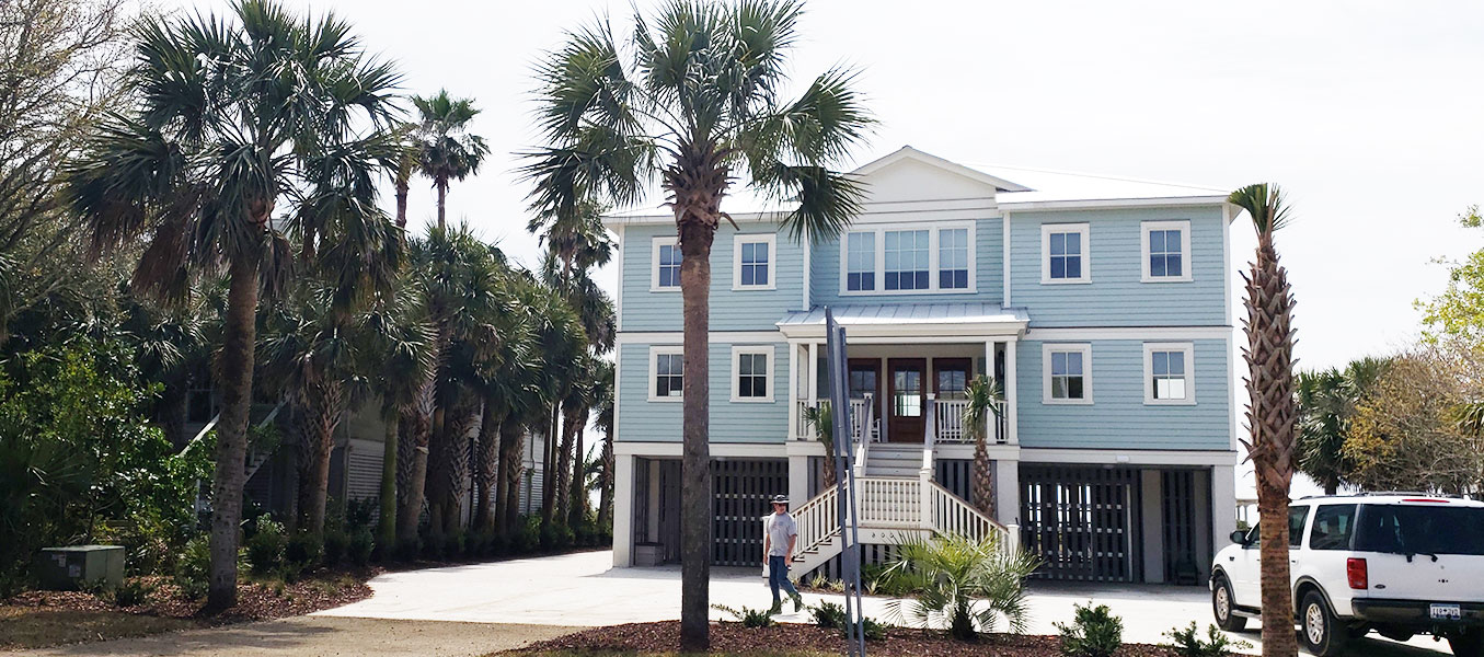 Elevated coastal home with raised foundation, ideal for flood-prone and hurricane-prone areas in Florida.